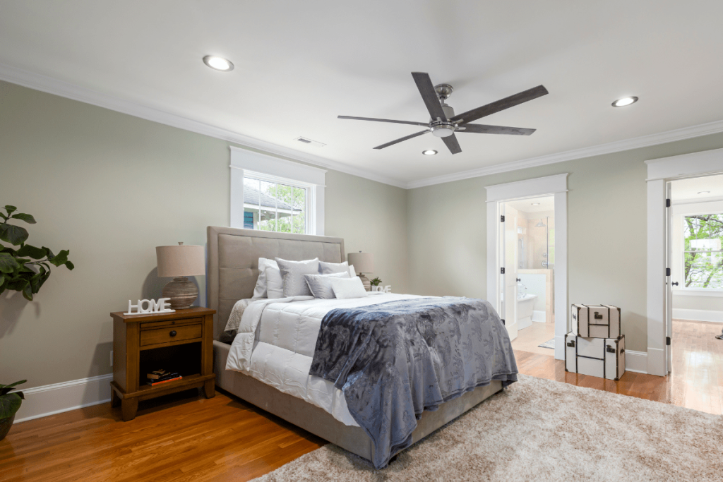 ceiling fan above bed