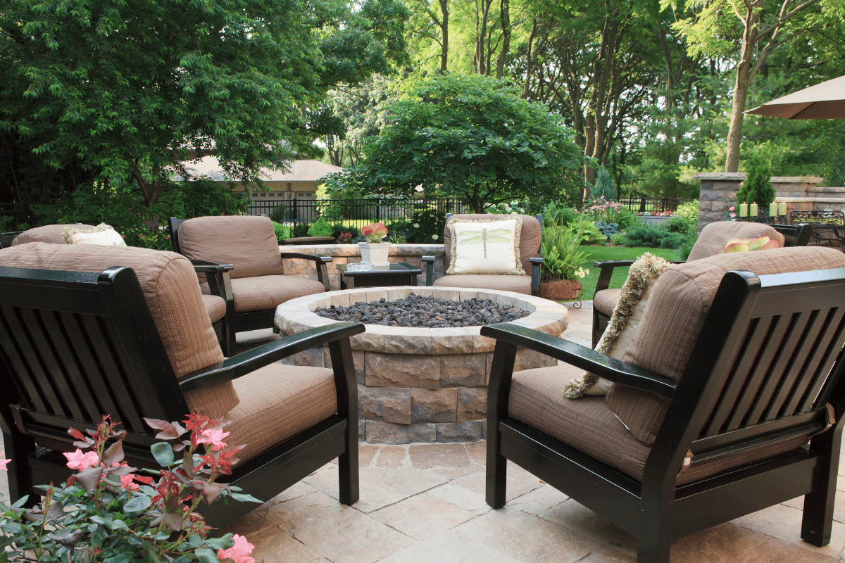 fire pit with chairs around it