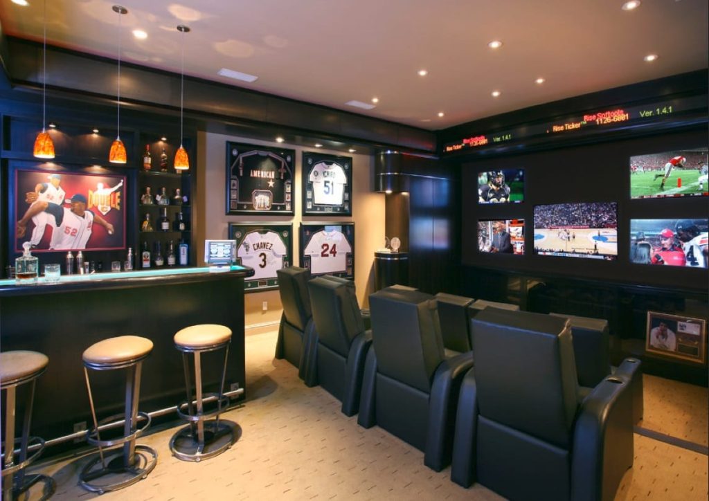 mancave with tv, bar and lighitng
