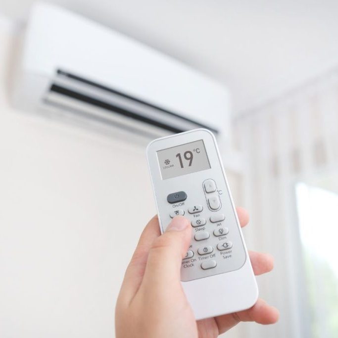 pointing remote at air conditioner