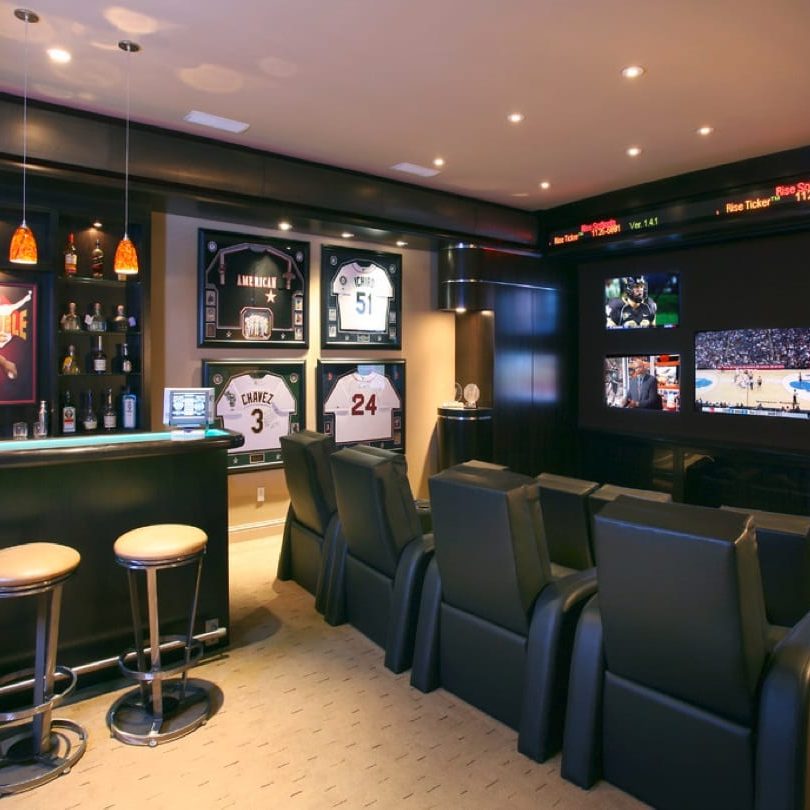 mancave with tv, bar and lighitng