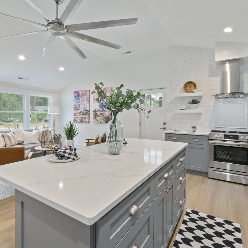 kitchen showcasing fan and downlights